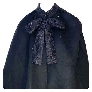 Black cape with sequin collar and lace bow